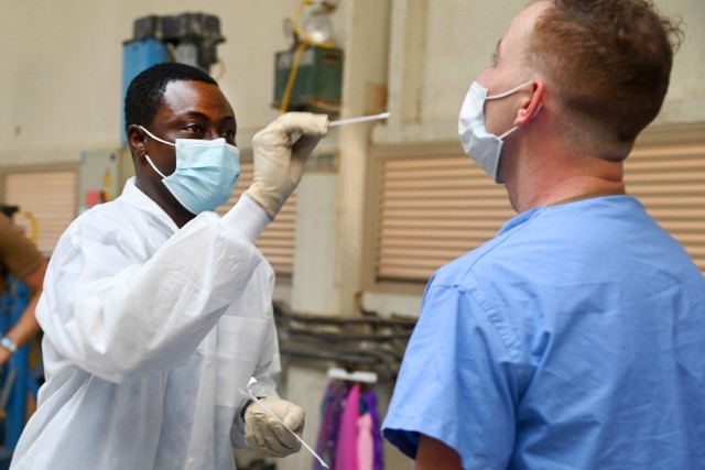NAVAL AIR STATION SIGONELLA, Italy (Aug. 20, 2021) Medical staff from Navy Medical Readiness and Training Command Sigonella rehearse COVID-19 screening procedures in support of the Department of Defense mission to facilitate the safe departure and...