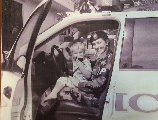 FORT BUCHANAN, Puerto Rico- Kari Atkinson and 2 year old son Taylor, in late 2004, calling in Atkinson's lunch break together. At the time of this photo, Atkinson was assigned to the last Active Duty units at Ft. Buchanan, the U.S. Army Garrison Military Police Detachment, and today she is the Director of Fort Lee, Virginia's Museums. (Courtesy Photo)