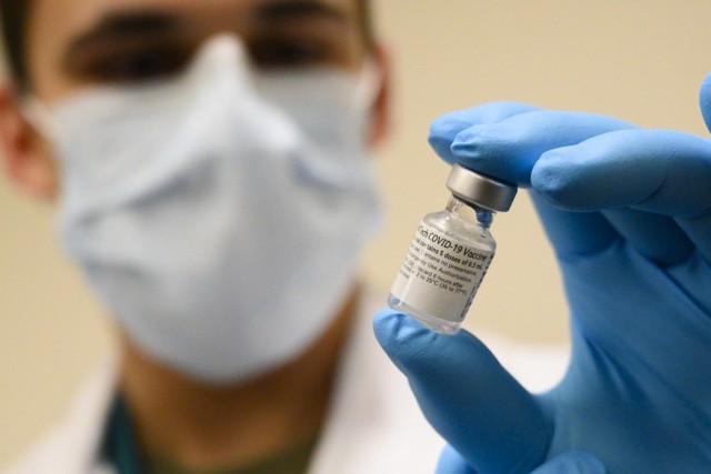 Army Spc. Angel Laureano holds a vial of the COVID-19 vaccine, Walter Reed National Military Medical Center, Bethesda, Md., Dec. 14, 2020. (DoD photo by Lisa Ferdinando)