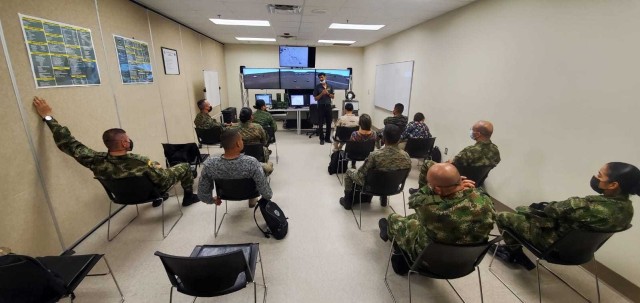 IACAP members conduct an after action report with the recorded action products from the Clarke Simulation Center. U.S. Army photo by U.S. Army Maj. Assad A. Raza