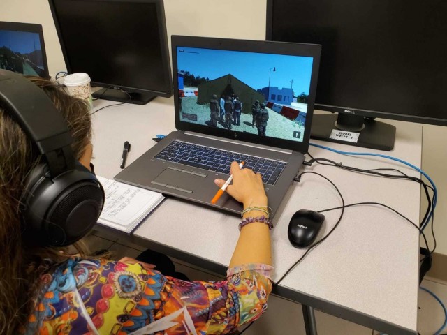 Ms. Adriana Buitrago Aguilera, Colombian Ministry of Defense rep. and Interagency Crisis Action Planning Course student (COL MOD) works through the scenarios during the IACAP capstone exercise. U.S. Army photo by MAJ Assad A. Raza