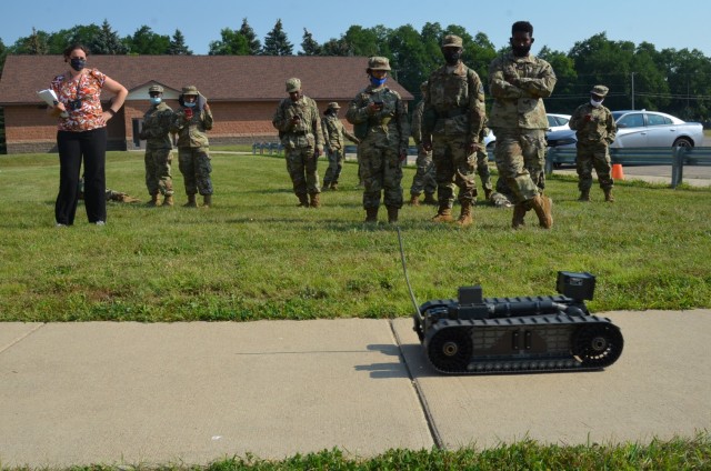DoD STEM K-12 Mathematics Teacher Nicole Ames-Powell conducts “PackBot” velocity determination experiments at a STEM Day camp Aug. 5 at Fort Custer, Mich. (U.S Army photo by Jerome Aliotta)
