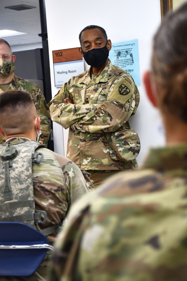 Maj. Gen. Jonathan Woodson, commanding general, Army Reserve Medical Command, speaks with cadets while touring the Troop Medical Clinic site for the 2021 Cadet Summer Training on Monday, July 12. The TMC site is a part of the ARMEDCOM medical support offered annually to the Fort Knox, Ky. training exercise, and ensures cadets are medically safe to train in the exercise and ready for commissioning. The CST is the largest annual training exercise executed by the U.S. Army, graduating almost 10,000 Cadets from Advanced Camp or Basic Camp each summer. More than 250 ARMEDCOM Soldiers have provided support to the exercise, including medics, physicians, x-ray technicians, pharmacy technicians and lab technicians.