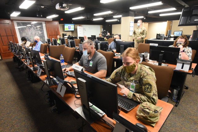 Members of Fort Knox Multi-agency Coordination Group oversee operations during an emergency preparedness exercise Aug. 25, 2021. Multiple crisis incidents were simulated simultaneously to test coordination efforts between multiple agencies.