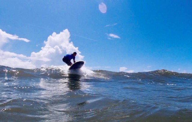 On July 15, Master Sgt. Ryan Serraro, a Soldier assigned to the Fort Bragg Soldier Recovery Unit, North Carolina, rode a wave at Carolina Beach during an adaptive surfing event. (Photo courtesy of Lee Whitford)