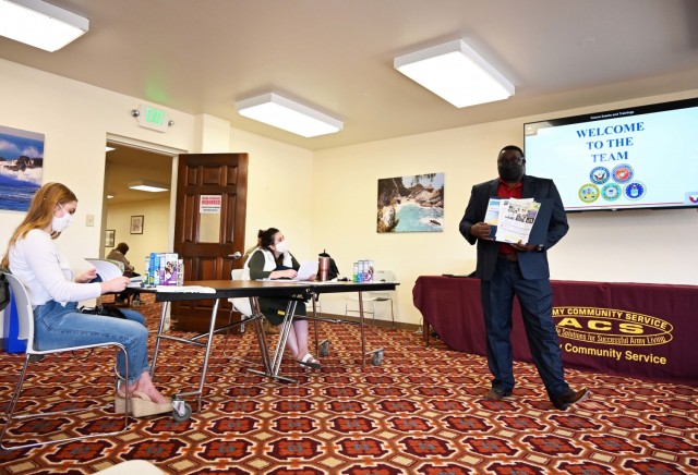 Charles Lyons, program specialist for Army Community Service and Presidio of Monterey Military Spouse Orientation organizer, speaks during the Presidio of Monterey Military Spouse Orientation at the General Stilwell Community Center, Ord Military Community, Calif., Aug. 23.