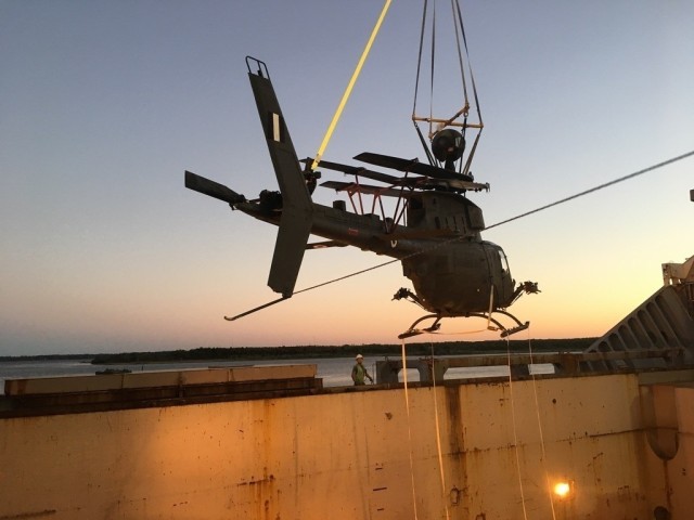 Loading of one of the six flyable aircraft into the transport ship at the port in Jacksonville, Florida. (Photo by John Zimmerman, Army Futures Command)