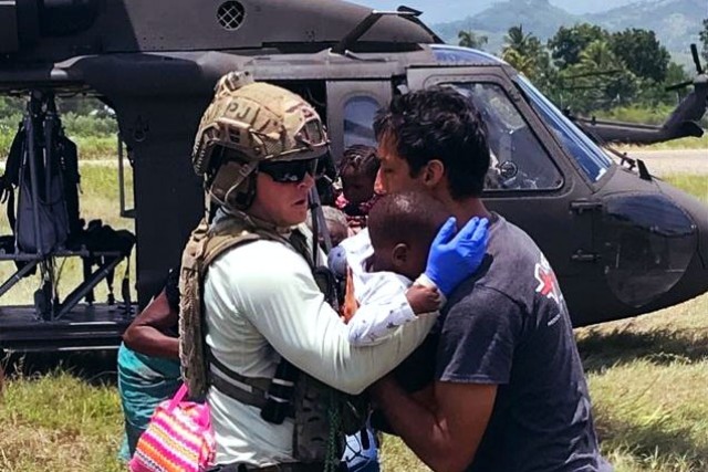 HAITI - While conducting an airfield survey of Las Cayes, Joint Task Force-Haiti personnel provide aid to Haitian citizens Aug. 20 as part of the U.S. military's support to earthquake relief. Joint Task Force-Haiti is conducting U.S. military...
