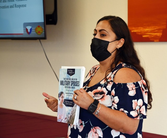 Angelica Sagastume, a work and family life specialist for the Navy Fleet and Family Support Center at La Mesa Village in Monterey, speaks during the Presidio of Monterey Military Spouse Orientation at the General Stilwell Community Center, Ord Military Community, Calif., Aug. 23.