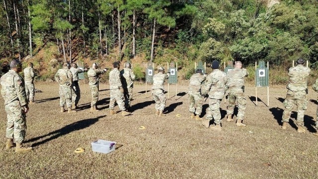 Security Assistance Training Management Organization instructors coach Security Assistance Team Training and Orientation Course students on proper firing technique during 9mm pistol block of instruction.