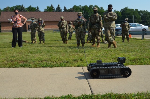 DoD STEM K-12 Mathematics Teacher Nicole Ames-Powell conducts “PackBot” velocity determination experiments at a STEM Day camp Aug. 5 at Fort Custer, Mich.