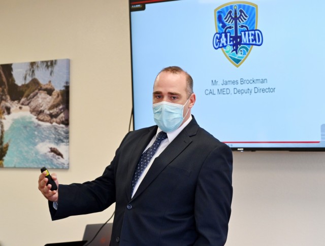 James Brockman, deputy director of the California Medical Detachment, speaks during the Presidio of Monterey Military Spouse Orientation at the General Stilwell Community Center, Ord Military Community, Calif., Aug. 23.