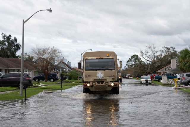 ST. JOHN THE BAPTIST PARISH, La. - Louisiana National Guard members in high-water vehicles and boats work with St. John the Baptist Parish officials to rescue people stranded in their homes in the wake of Hurricane Ida.