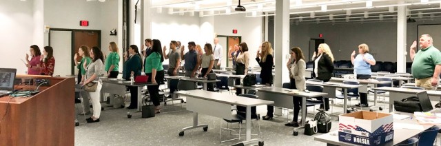 Army Contracting Command-Rock Island&#39;s newest group of interns recite the Oath of Office while they were being in-processed at the Rock Island Arsenal, June 21. (Photo by Rachel Phelps, branch chief, ACC-RI Intern Homeroom)