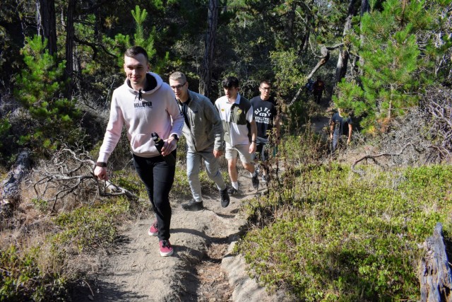 From front, Noah Sheppard, Iman Javanmardi, Sam Chase, Andres Ramirez and Brandon Munoz, military service members and students at the Defense Language Institute Foreign Language Center, hike during the Volksmarch at the Presidio of Monterey,...