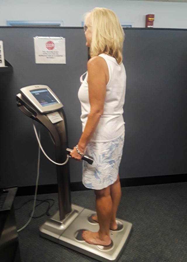 Mary Ann Wicks, G1 (Human Resources), U.S. Army Sustainment Command, uses the Tanita body composition machine to provide a real-time snapshot of her physical health.  The body analysis information includes:  weight, body fat, body water, muscle...