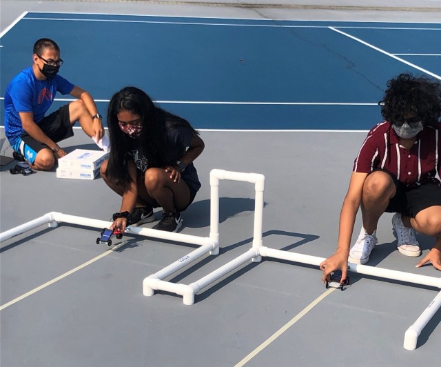 Students in the “Earth and Environmental Science” GEMS program class face off in a solar car race at Hood College featuring cars they built during class. 