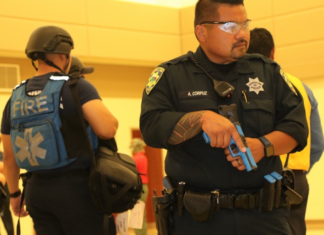 Police Officer Alan Corpuz from the Mountain View Police Department maintains a safe perimeter for Response Task Force emergency medical services and fire department personnel during active-shooter response training, at the Sgt. James Witowski...