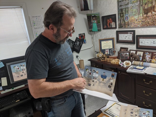 Jeff Fox, the illustrator/graphic designer from Fort Drum Public Works’ Signs and Graphics Section, spent several weeks last year designing and constructing a Medal of Honor wall display in honor of Staff Sgt. Travis Atkins, the 2nd Brigade...