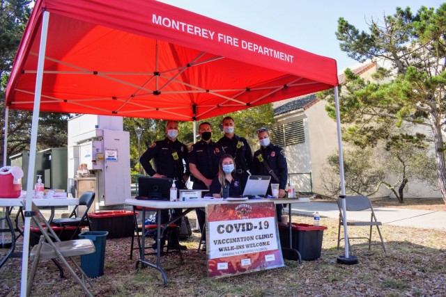 From left, Monterey Fire Department Capt. Dave Meurer, Assistant Chief Jim Courtney, Paramedic Brendan Coalwell, Paramedic Shelli Bezouska and, sitting, Fire Prevention Technician Kristine Wade get ready to provide COVID-19 vaccinations during the...
