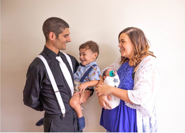 Air Force Maj. Daniel “Frenchy” Bourgeois holds Westley and Elisa Bourgeois holds Finnley in a recent family photo. Both children were born at Brooke Army Medical Center and received care from Jonathan Stevens, neonatal intensive care unit clinical nurse. (Courtesy Photo)