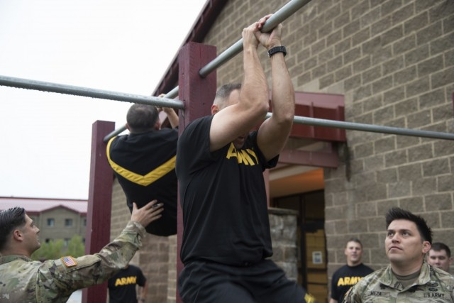 Soldiers with the U.S. Army Corps of Engineers – Alaska District perform leg tucks during the Army Combat Fitness Test on Aug. 17 at Joint Base Elmendorf Richardson. Non-commissioned officers with the 6th Brigade Engineer Battalion administered...