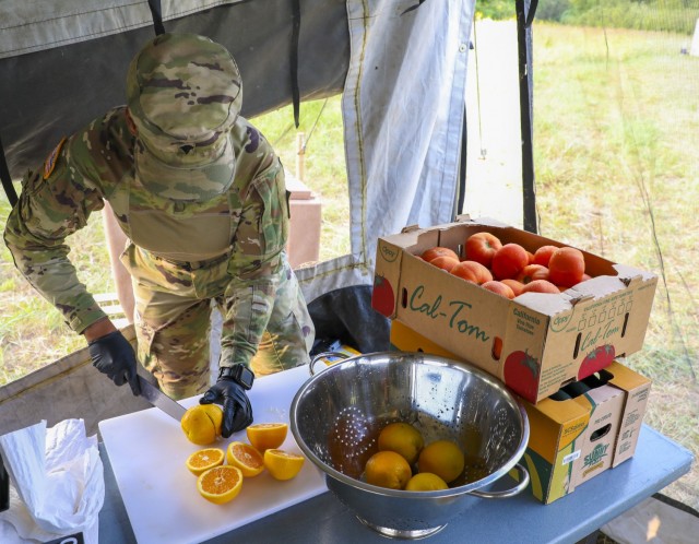 U.S. Army Spc. Ashely Ward, a culinary specialist assigned to 511th Quartermaster Company, Special Troops Battalion, 1st Sustainment Brigade, 1st Infantry Division, conducts food preparation during the U.S. Army Forces Command (FORSCOM) level of...