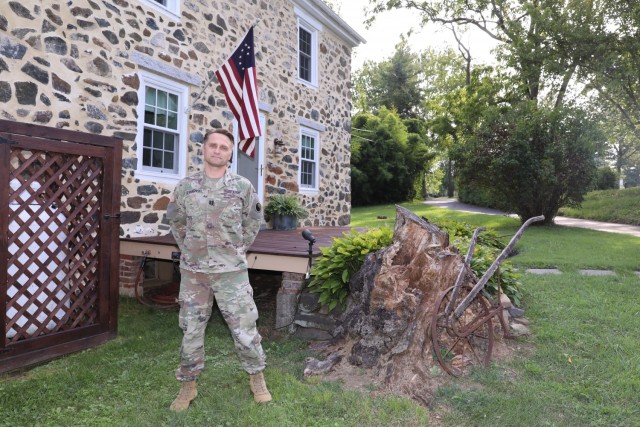 U.S. Army Capt. Fiodor Strikovski, military intelligence officer, 29th Combat Aviation Brigade, Maryland National Guard, in front of his home in Fallston, Maryland, Aug. 6, 2021. Before Strikovski moved to America and joined the MDNG, he was a...