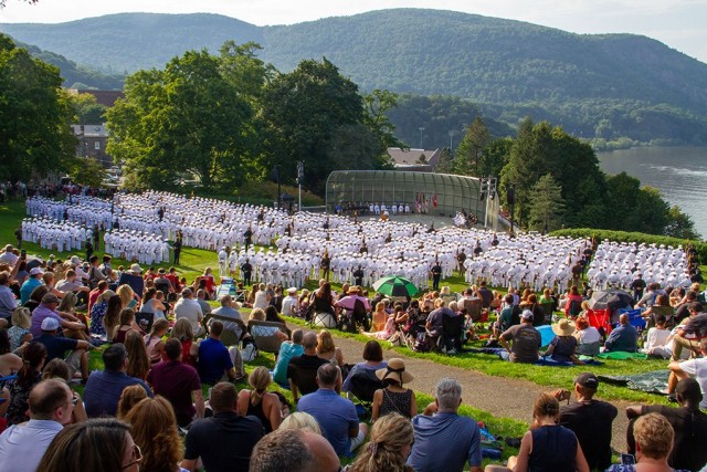 Members of the U.S. Military Academy Class of 2022 enthusiastically show off their rings after they received them during the annual Ring Weekend ceremony Friday in front of family and friends (right) at the Trophy Point Amphitheater. The weekend also included a run and banquet to celebrate the milestone event. The tradition of the class ring at USMA first began in 1835. Years later, Ron Turner, USMA Class of 1958, developed the idea of incorporating the gold of alumni rings into the current classʼ rings. In November 2000, the Herff Jones Company melted gold of 31 rings with that year's class through the Class Ring Memorial Program. This year, 52 graduates gifted their rings to the program for the Class of 2022.