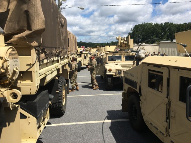 A massive convoy of Georgia National Guard personnel and equipment prepares to depart the armory of the 170th Military Police Battalion, 201st Regional Support Group, in Decatur, Georgia, Sept. 1, 2021. Convoys from across the state are moving...