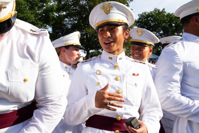 A Class of 2022 Cadet receives her class ring and places it on her finger during the Ring Weekend ceremony Friday at the Trophy Point Amphitheater.