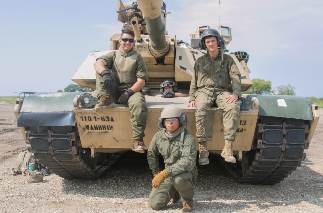A gunnery crew from the 1st Combined Arms Battalion, 63rd Armor Regt. poses for a photo at the Douthit Range Complex at Fort Riley, KS on Aug. 31, 2021. These Soldiers are a part of 'Dagger' brigade’s gunnery competition, which tested their...