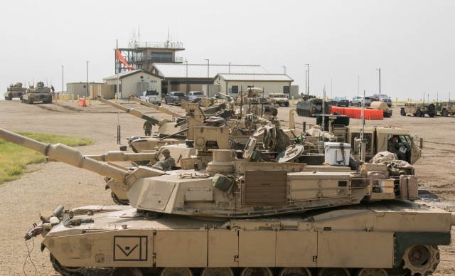 Tankers from the 1st Combined Arms Battalion, 63rd Armor Regt. prepare their tanks for a gunnery competition at the Douthit Range Complex at Fort Riley on Aug. 31, 2021. These tanks are equipped with a main gun as well as machine guns. 
...
