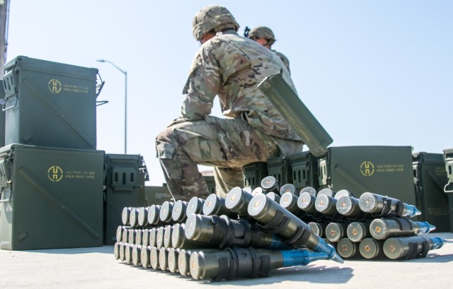 Soldiers from the 82nd Brigade Engineer Battalion, 2nd Armored Brigade Combat Team, 1st Infantry Division offload ammo from their Bradley Fighting Vehicles at the Douthit Range Complex at Fort Riley, KS on Aug. 30, 2021. Soldiers competed in the...