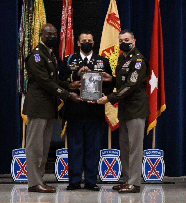 Maj. Gen. Milford H. Beagle Jr. and Command Sgt. Maj. Mario O. Terenas, 10th Mountain Division (LI) and Fort Drum commander and senior enlisted adviser, present retired Command Sgt. Maj. Christopher K. Greca with the Warrior Legend Hall of Fame...