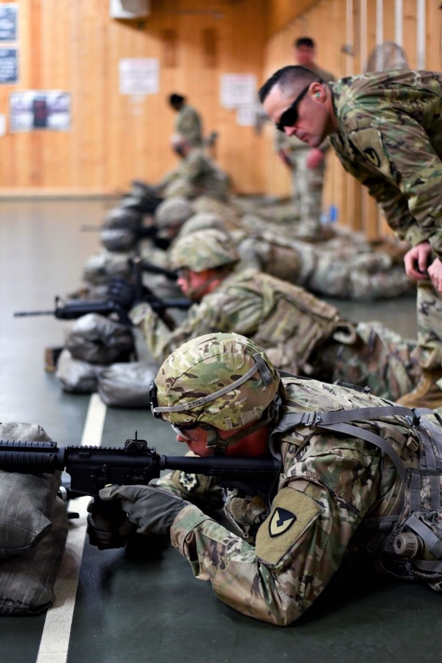 Soldiers participate in an indoor firing range training evaluation at the Panzer Kaserne Range Complex at USAG Stuttgart as part of the 2020 Installation Management Command Directorate-Europe “Best Warrior” Competition.
