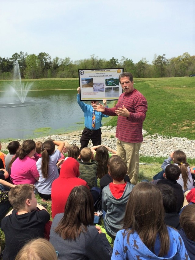 Children learn about a geothermal pond initiative from members of the Fort Knox energy team. 