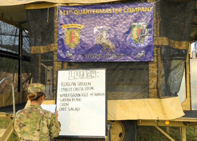 U.S. Army 2nd Lt. Abigail del Rosario, 2nd platoon leader for the 511th Quartermaster Company, Special Troops Battalion, 1st Sustainment Brigade, 1st Infantry Division, writes the lunch menu during the U.S. Army Forces Command (FORSCOM) level of...