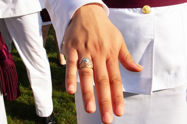 A Class of 2022 cadet shows off her class ring after the Ring Weekend ceremony Friday at the Trophy Point Amphitheater.
