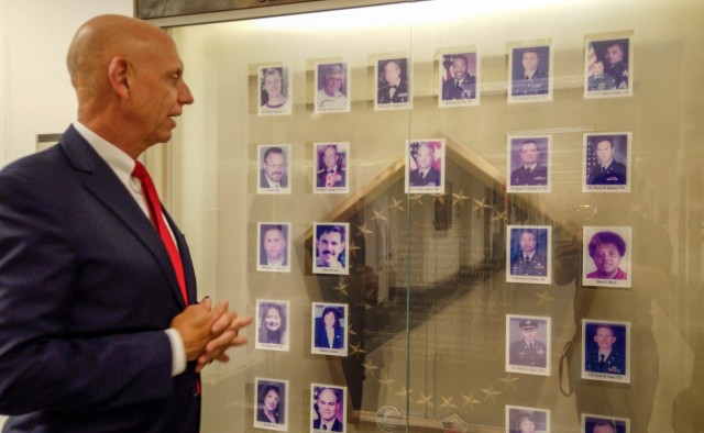 Franklin Childress, director of Army Reserve communications, stands by a memorial he designed in the Pentagon, honoring the 29 people killed on 9/11 from the offices of the Assistant Secretary of the Army for Manpower and Reserve Affairs and the...