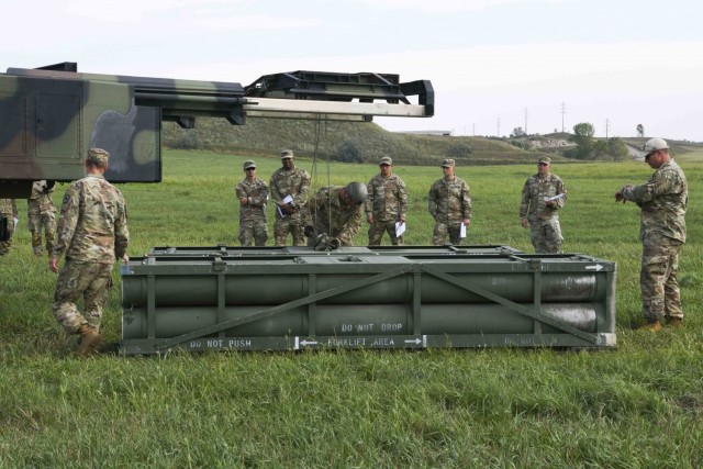 Members of the U.S. Army’s Bravo Battery, 4th Battalion, 4th Security Forces Assistance Brigade, evaluate operations of the High Mobility Artillery Rocket System while attending the Combined Duties Training Course hosted by the 2nd Battalion...