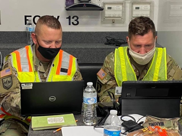 Lt. Col. Andy Yount, with the U.S. Army Corps of Engineers Pittsburgh District, and Capt. Ben Waring at the Generator Staging Base in the Sherwood Forest community of Baton Rouge, Louisiana. The two district members are deployed to the region...