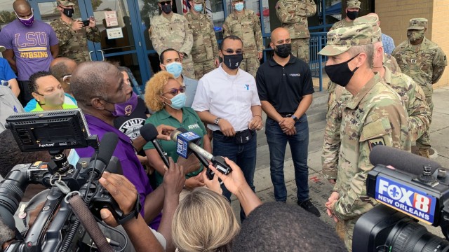 Army Gen. Daniel Hokanson, chief, National Guard Bureau, talks with community leaders during a visit to assess the Hurricane Ida response and thank troops in New Orleans, Louisiana, Sept. 7, 2021. This image was acquired using a cellular device....