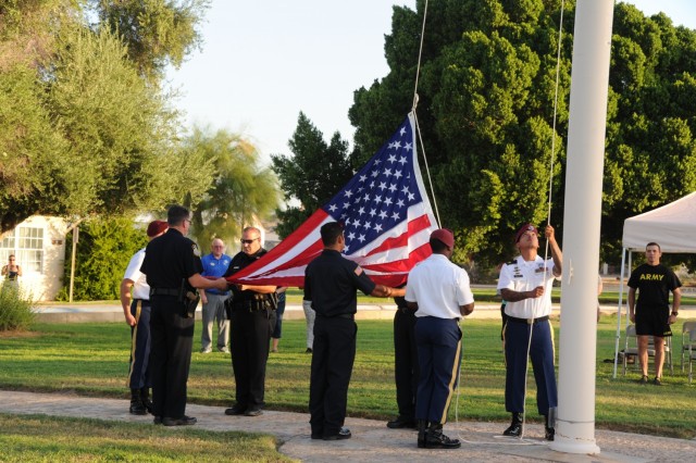 Members of U.S. Army Yuma Proving Ground&#39;s Airborne Test Force joined the post&#39;s police and firefighters in raising the flag to half-staff at a somber ceremony commemorating the 20th anniversary of the September 11, 2011 terrorist attacks. In remarks at the ceremony, YPG Commander Col. Patrick McFall praised the courageous service of first responders on that terrible day, and that of uniformed personnel in the years that followed. 

“After 9/11, thousands of Soldiers, Sailors, Marines, and Airmen made the ultimate sacrifice to defend our nation and values,” McFall said. “But thousands- I repeat, thousands- more of our troops were saved from death and injury by the work performed by our dedicated employees at Yuma Proving Ground. Our workforce proved year after year that it will rise to any challenge if it involves protecting our nation and its troops. ”