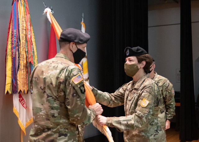 Maj. Gen. Maria B. Barrett, Commanding General U.S. Army Network Enterprise Technology Command (NETCOM) passes the 7th Signal Command (Theater) colors to Col. Mark D. Miles, 7th Signal Command (Theater) commander at a ceremony at Fort Meade’s post theater, Sept. 1, 2021. 