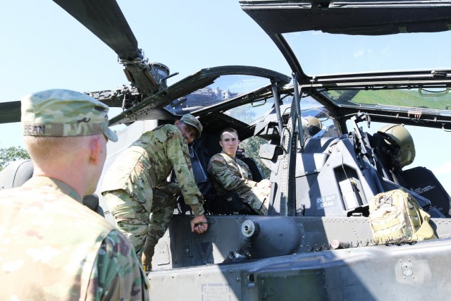 A cadet sits in the cockpit of an Apache taking in information from its crew during Branch Week festivities Tuesday at West Point. Branch Week is an annual event that allows cadets to learn more about the 17 U.S. Army branches.               
Photo by Delancey Pryor III/PV