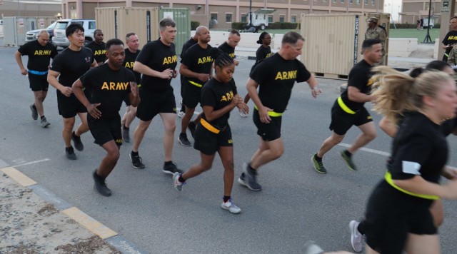 "Spears Ready" Soldiers of the 3rd Expeditionary Sustainment Command dash from the starting line for the two-mile run, the final of six events at the unit's Sept.7, 2021 Army Combat Fitness Test familiarization event at Camp Arifjan, Kuwait. The 3rd ESC Soldiers began their nine-month tour staffing 1st Theater Sustainment Command's operational command post Aug. 28, 2021.