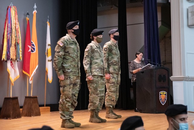 Maj. Gen. Christopher L. Eubank (left), outgoing 7th Signal Command (Theater) Commanding General, Maj. Gen. Maria B. Barrett, Commanding General U.S. Army Network Enterprise Technology Command (NETCOM) and Col. Mark D. Miles, 7th Signal Command (Theater) incoming commander stand at attention during an uncasing and change of command ceremony at Fort Meade’s post theater, Sept. 1, 2021. 