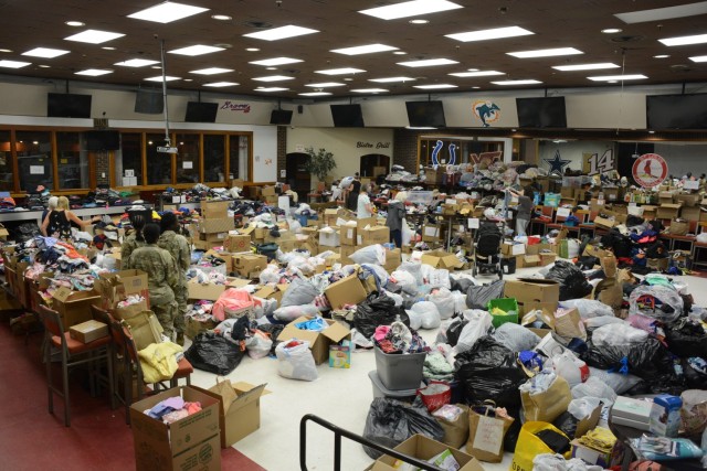 Volunteers fold, sort and organize donations in support of Operation Allies Welcome on Fort Lee, Virginia, Sept. 9....