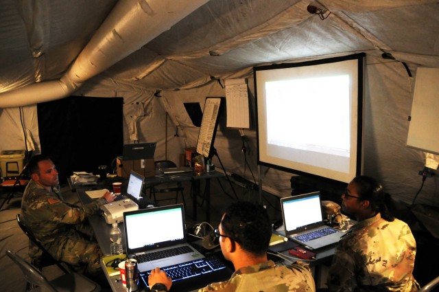 46th Engineer Battalion, 20th Engineer Brigade, Soldiers work in a command center in the aftermath of Hurricane Ida to coordinate support on Grand Isle, Louisiana, Sept. 8.
